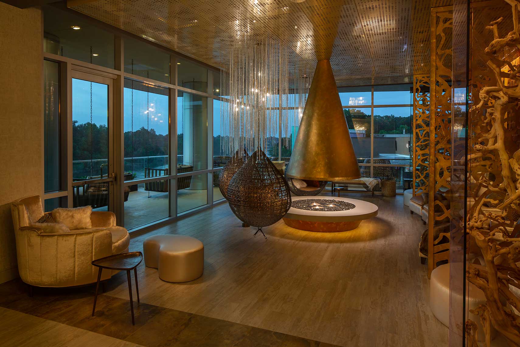 Spa Reserve at Wind Creek Wetumpka — copper-leaf canopy, crystal-rain chandelier, and Coosa River-view lounge